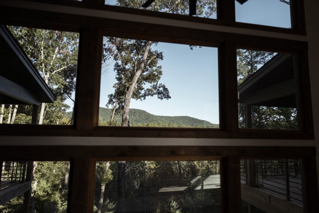 A view of the mountains through a window. 