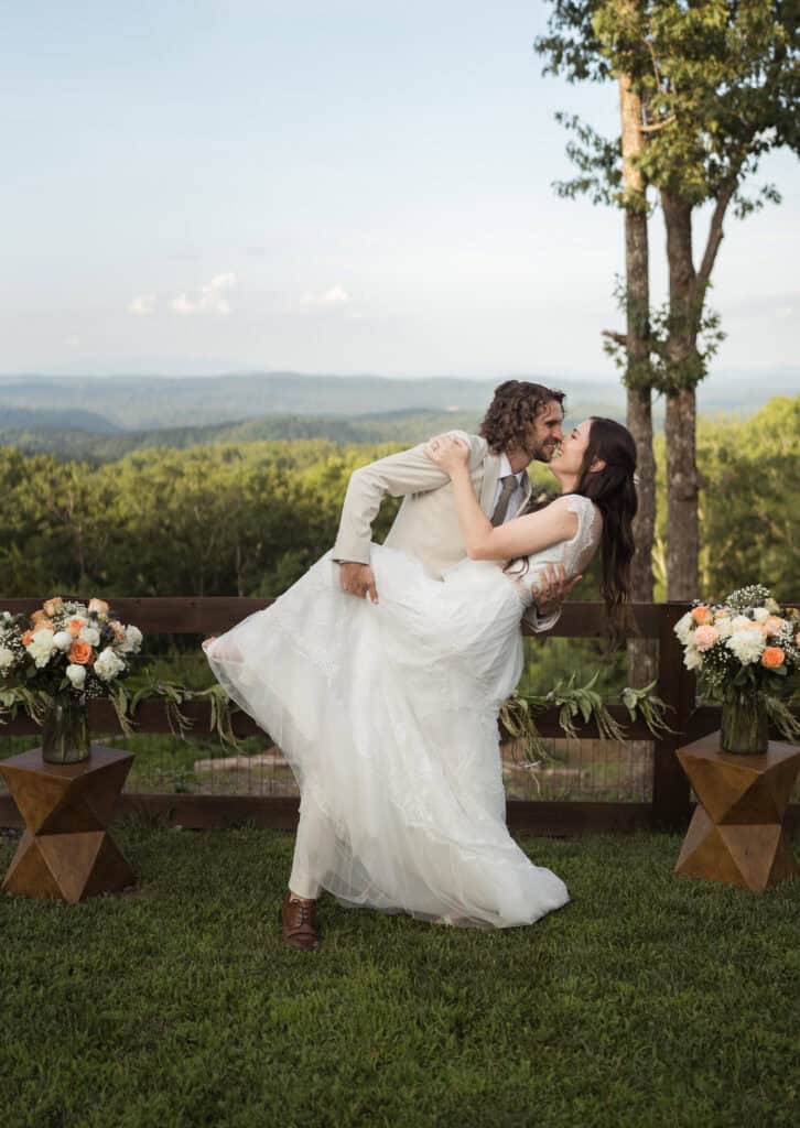 A newlywed couple does the traditional dip after their wedding ceremony. 