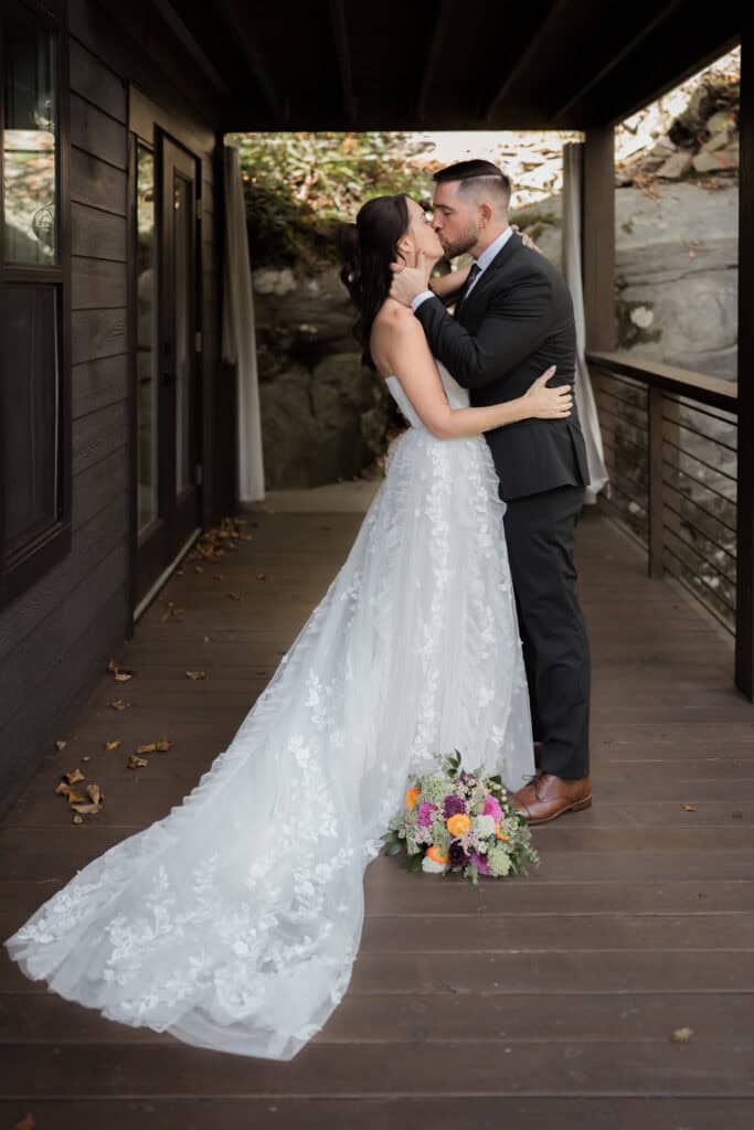 A newlywed couple kissing after their ceremony.