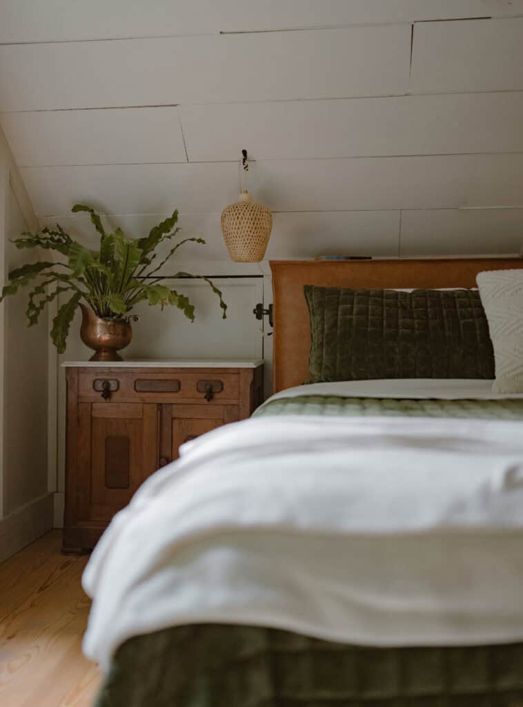 A view of a aesthetic master bedroom with unique lighting. 