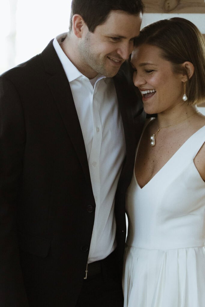 A newlywed couple happily embracing each other. 